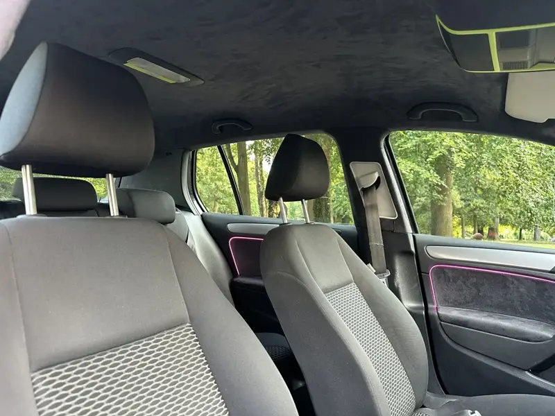 Alcantara door card with a purple ambient light strip
