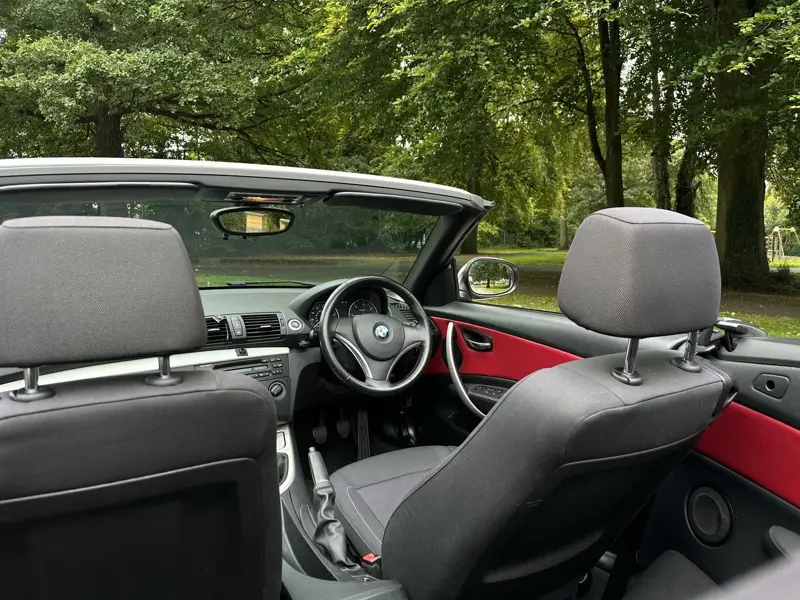 Burgundy door cards seen from the rear seats