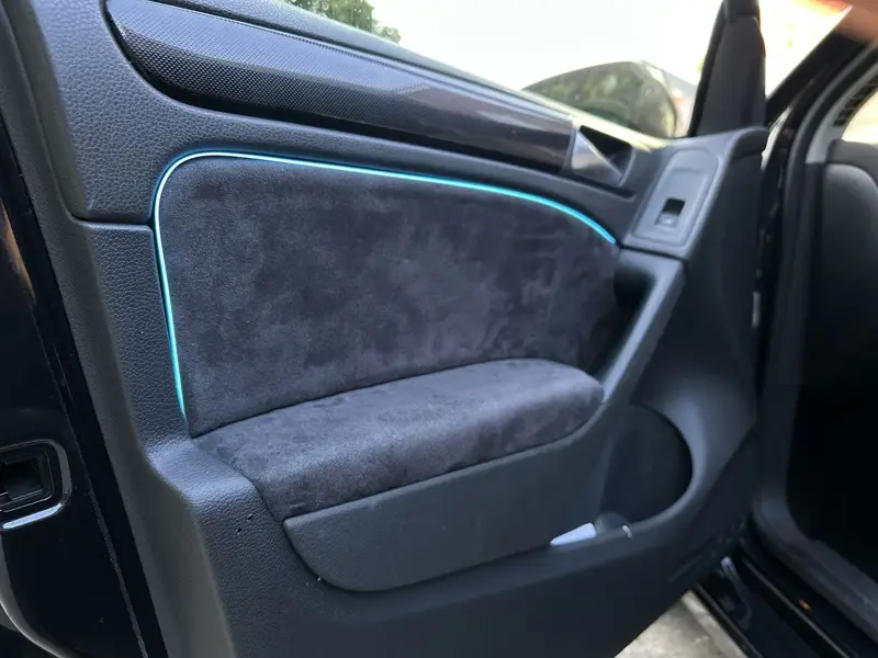 Alcantara door card with a blue ambient light strip