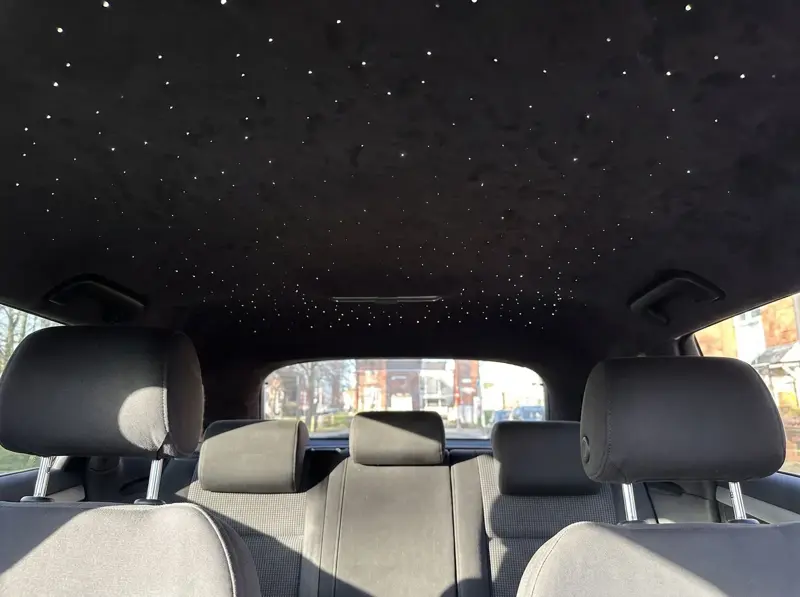 Starlight headliner glowing above the seats of an Audi A3